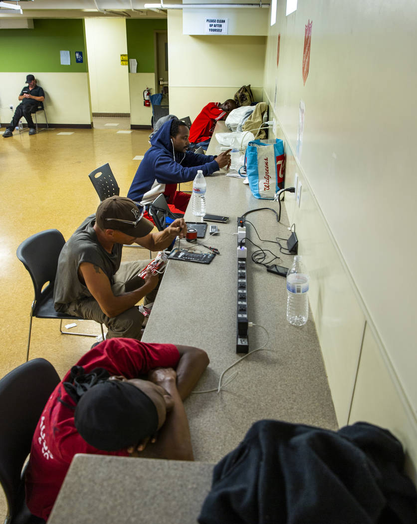 Clients charge their electronics in the day room at The Salvation Army, which offers a summer d ...