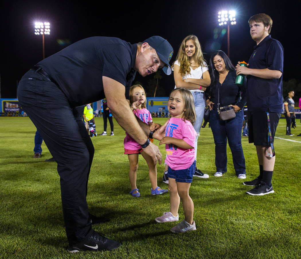 Las Vegas Lights FC coach Eric Wynalda comforts his daughter Elliotte, 3, following the game ve ...