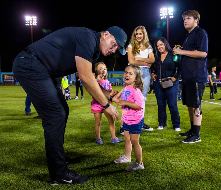 Las Vegas Lights FC coach Eric Wynalda comforts his daughter Elliotte, 3, following the game ve ...