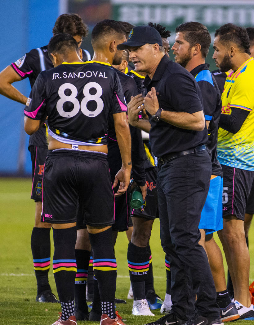 Las Vegas Lights FC forward Junior Sandoval (88) is counseled by head coach Eric Wynalda during ...