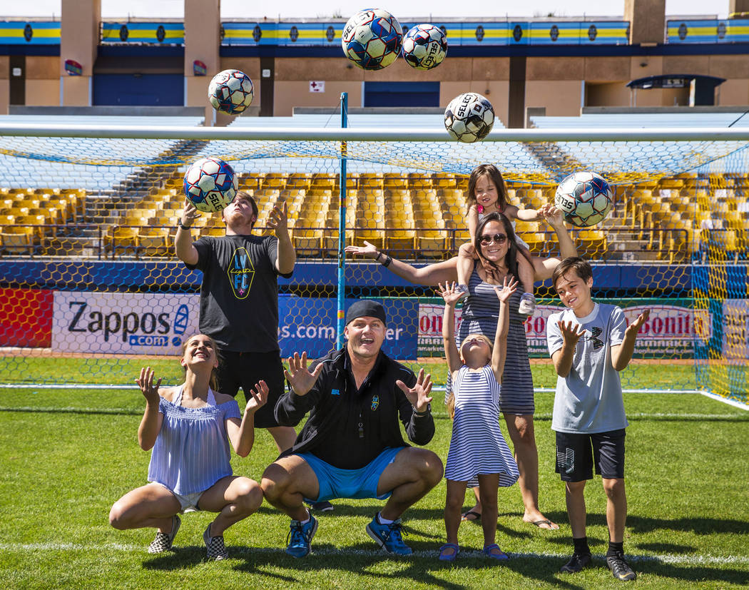 Las Vegas Lights FC coach Eric Wynalda and his family come together following practice at Cashm ...