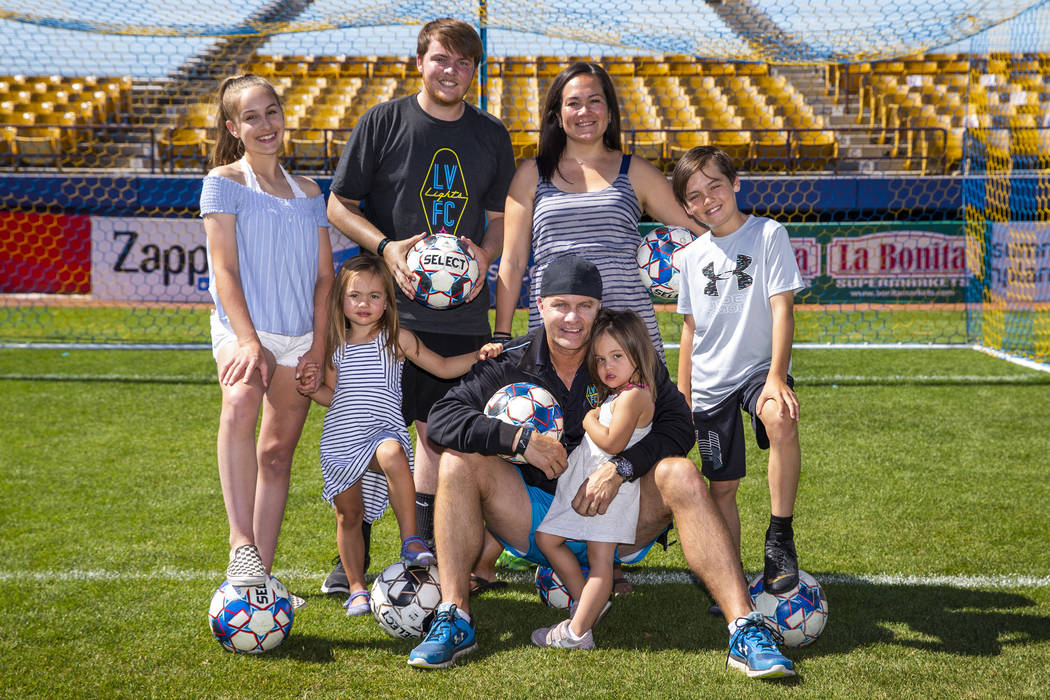 Las Vegas Lights FC coach Eric Wynalda and his family come together following practice at Cashm ...