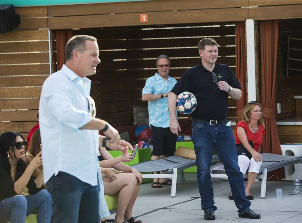 Brett Lashbrook, owner and CEO of Lights FC, right, looks on during preparations for the team's ...