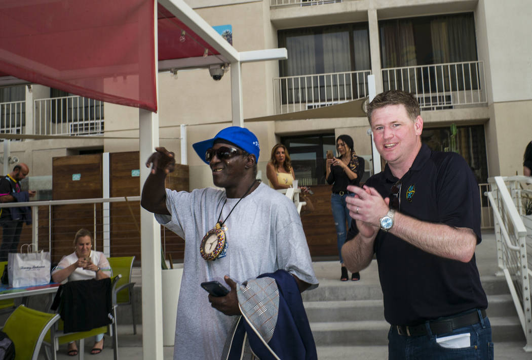 Brett Lashbrook, owner and CEO of Lights FC, right, introduces entertainer Flavor Flav, left, a ...