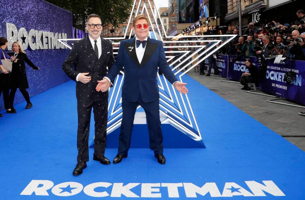 In this May 20, 2019, file photo, musician Elton John and his husband producer David Furnish, l ...