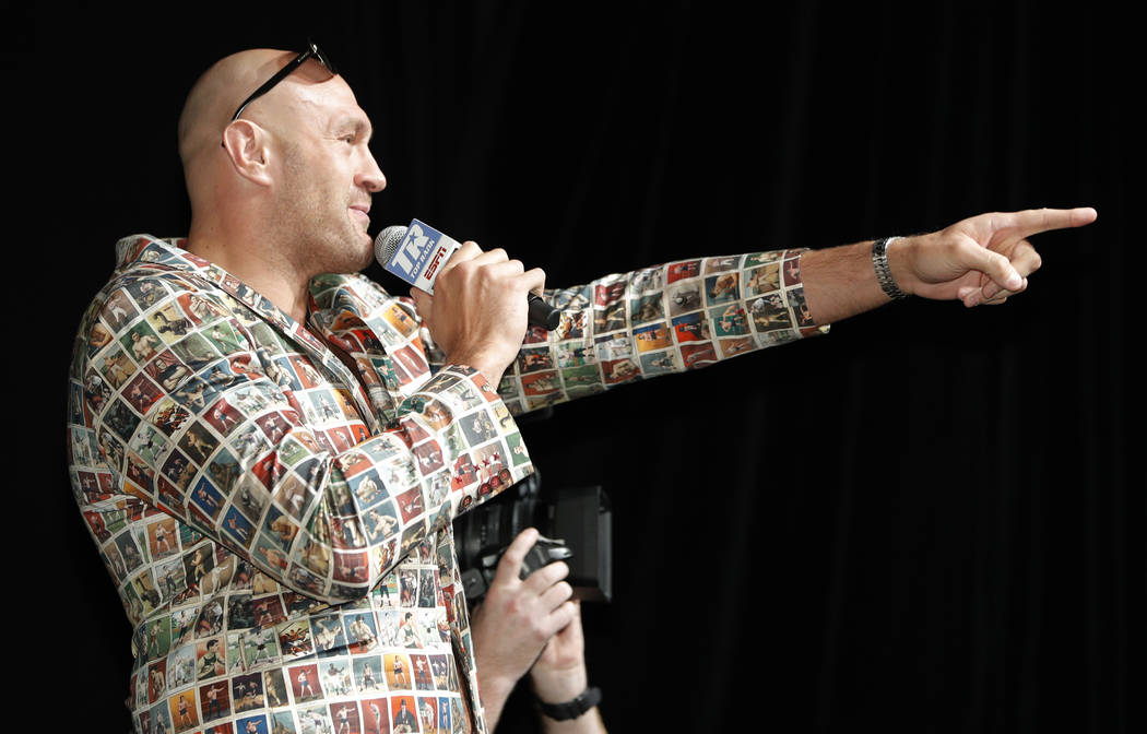 Tyson Fury, left, of England, speaks during a news conference, Wednesday, June 12, 2019, in Las ...