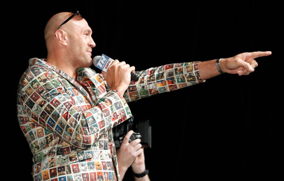 Tyson Fury, left, of England, speaks during a news conference, Wednesday, June 12, 2019, in Las ...