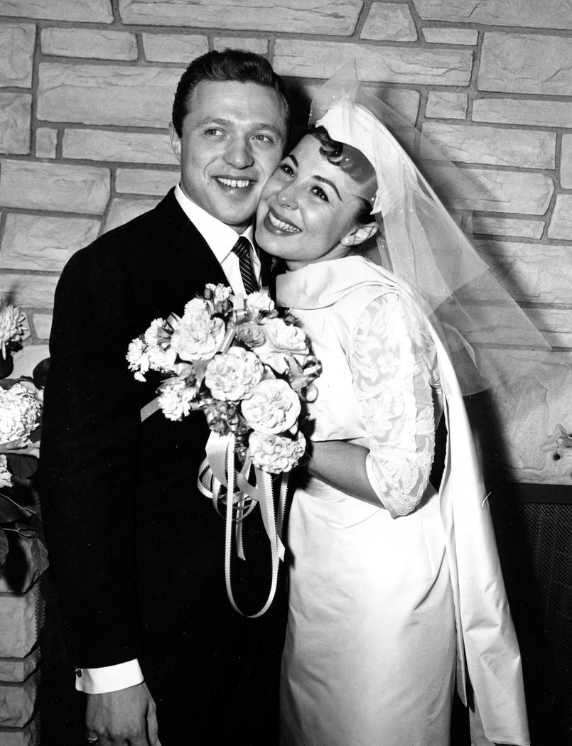 FILE - This Dec. 29, 1957 file photo, shows Eydie Gorme and Steve Lawrence, both 22, on their ...