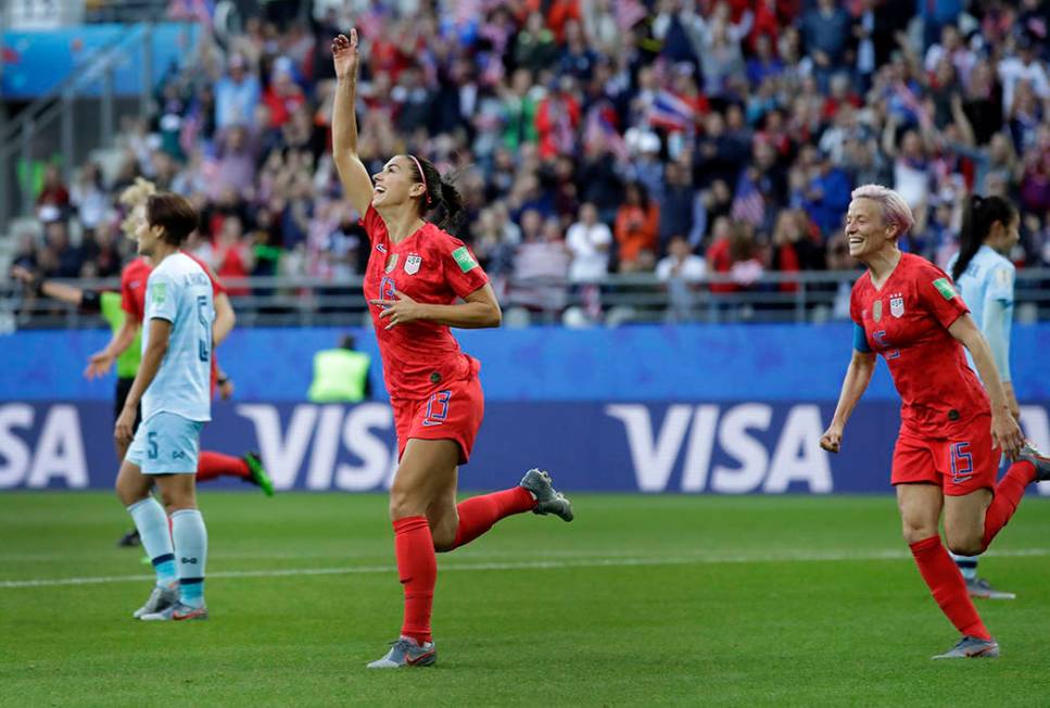 United States' Alex Morgan, left, celebrates after scoring the opening goal during the Women's ...