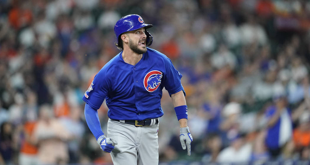 Chicago Cubs' Kris Bryant watches his home run against the Houston Astros during the third inni ...