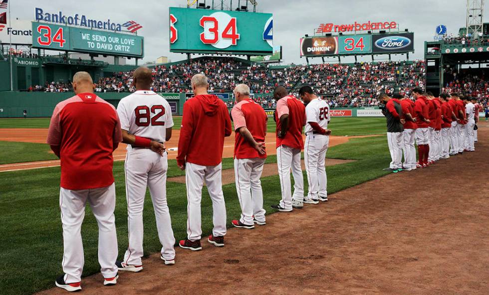 The Boston Red Sox and fans pause for a moment for former Red Sox designated hitter David Ortiz ...