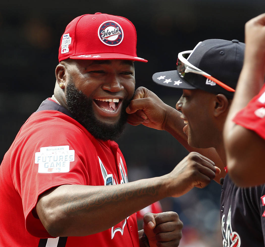 In this July 15, 2018, file photo, World Team Manager David Ortiz (34) speaks with U.S. Team Ma ...