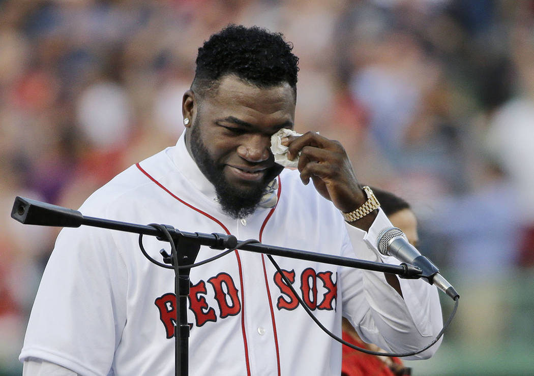 In this June 23, 2017, file photo, Boston Red Sox baseball great David Ortiz wipes a tear at Fe ...