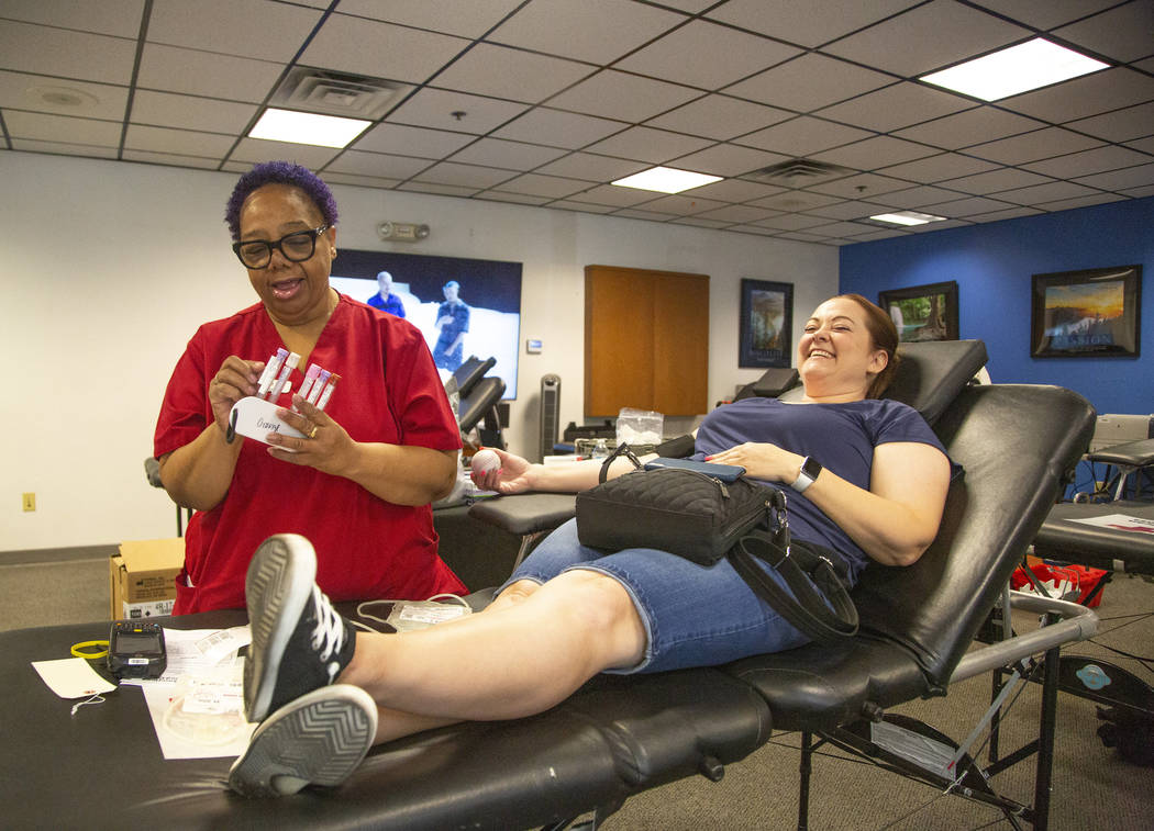 Barbara Moor, 57, prepares to draw blood from Audra Findley, during the American Red Cross bloo ...