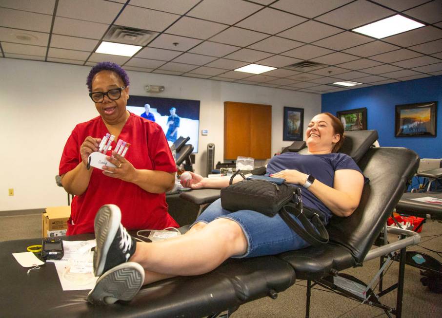 Barbara Moor, 57, prepares to draw blood from Audra Findley, during the American Red Cross bloo ...
