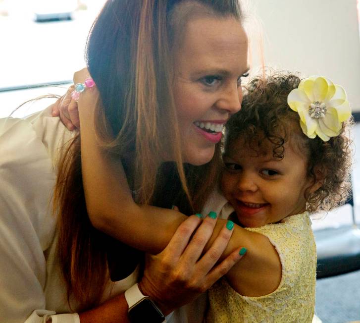 Layla O'Bryant, 4, who needs blood transfusions, hugs her mom Molly O'Bryant during the America ...