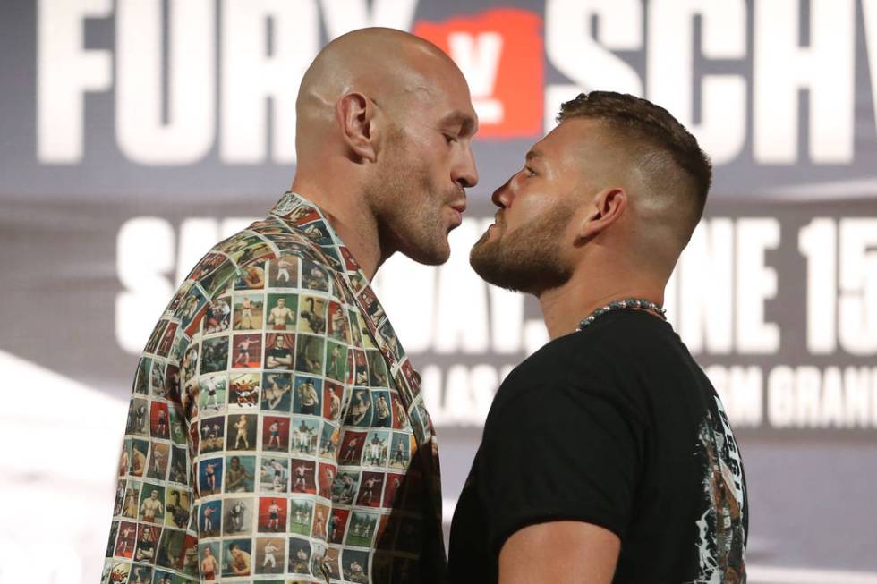 Tyson Fury, left, and Tom Schwarz, pose during their boxing press conference at the MGM Grand h ...