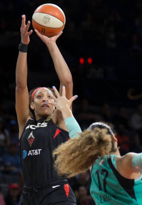 Las Vegas Aces center A'ja Wilson (22) shoots a corner jump shot over New York Liberty center A ...