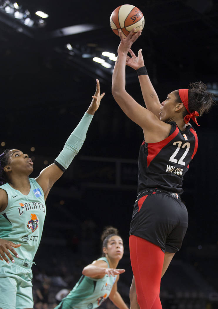 Las Vegas Aces center A'ja Wilson (22) shoots a corner jump shot over New York Liberty forward ...