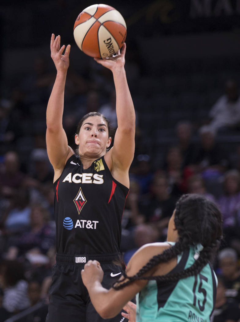 Las Vegas Aces guard Kelsey Plum (10) shoots a jump shot over New York Liberty guard Brittany B ...