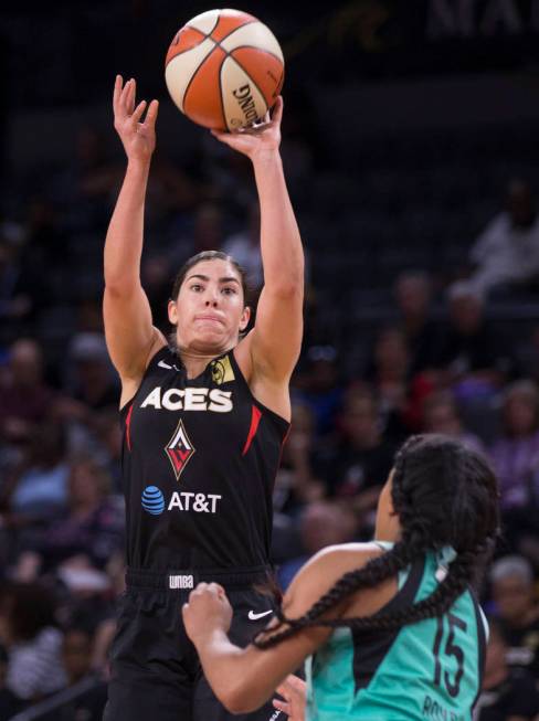 Las Vegas Aces guard Kelsey Plum (10) shoots a jump shot over New York Liberty guard Brittany B ...