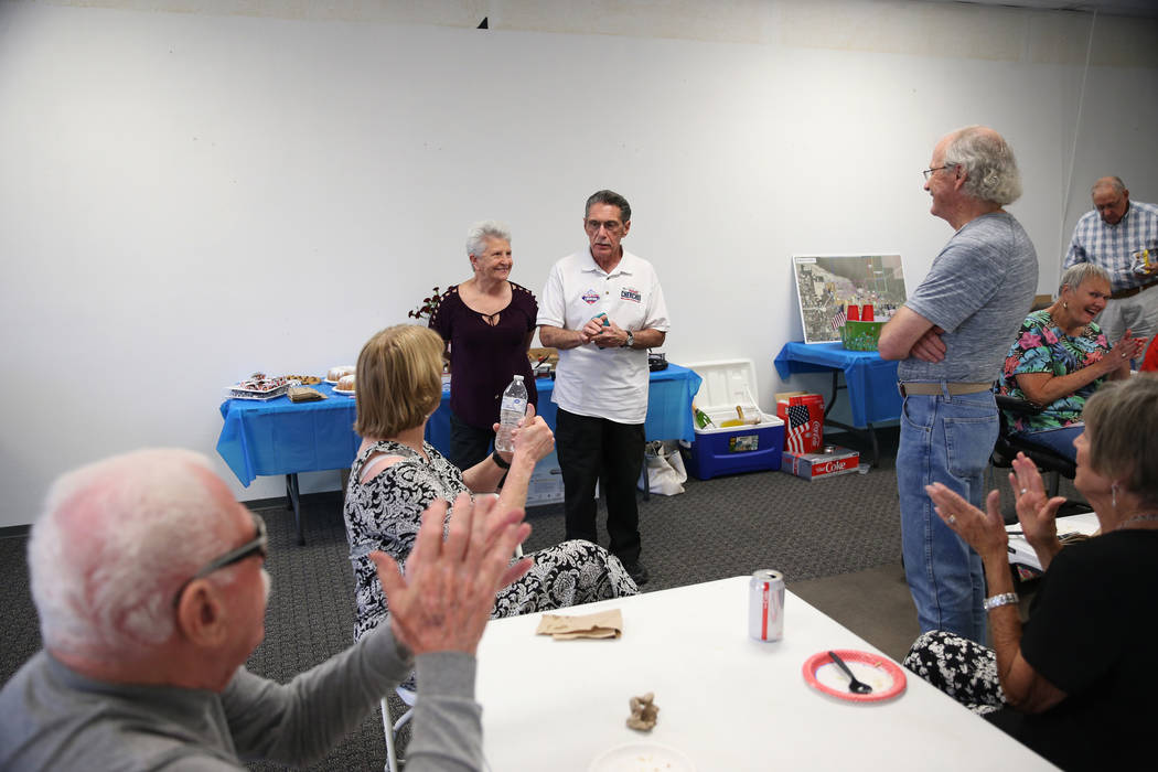 North Las Vegas Ward 4 incumbent councilman Richard Cherchio, center, with his wife, Gloria, le ...