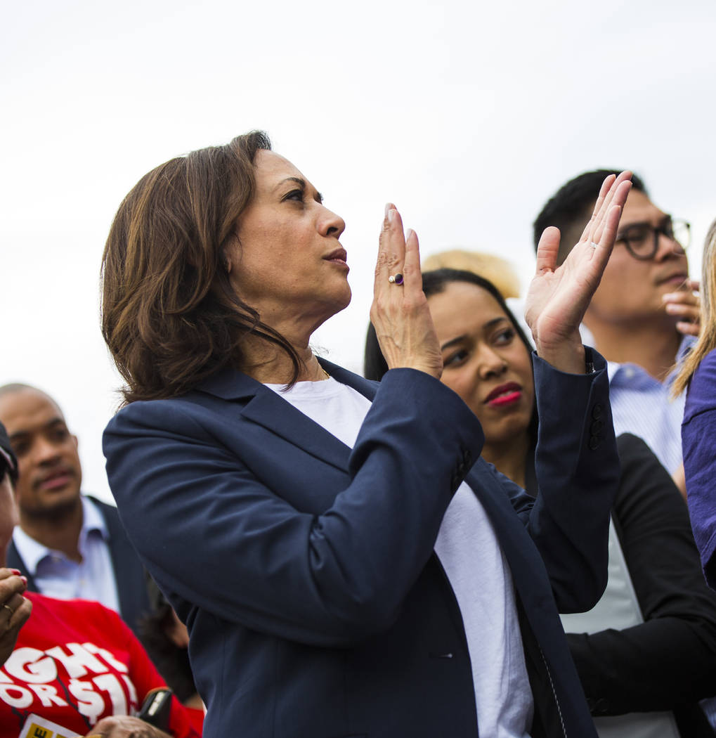 U.S. Sen. Kamala Harris, D-Calif., a Democratic presidential hopeful, claps while listening to ...
