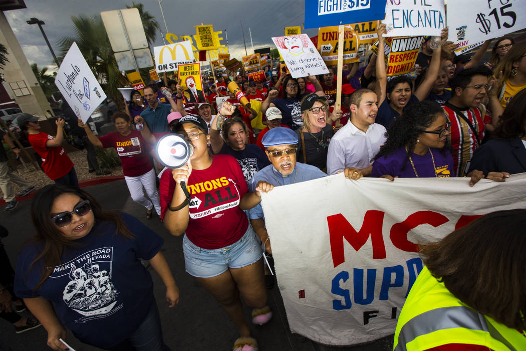 Workers march in support of high minimum wage outside of McDonald's in Las Vegas on Friday, Jun ...