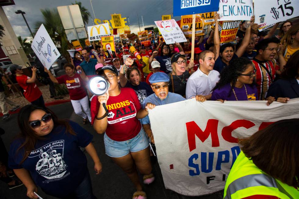 Workers march in support of high minimum wage outside of McDonald's in Las Vegas on Friday, Jun ...