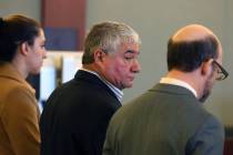 Henderson Constable, Earl Mitchell, center, appears in court with his attorneys Alanna Bondy, l ...