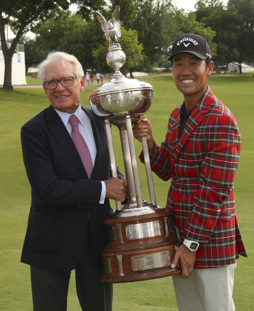 Charles Schwab and Kevin Na pose with the Leonard Trophy after Na won the Charles Schwab Challe ...