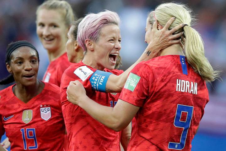 United States' scorer Lindsey Horan, right, celebrates their side's 3rd goal with Megan Rapinoe ...