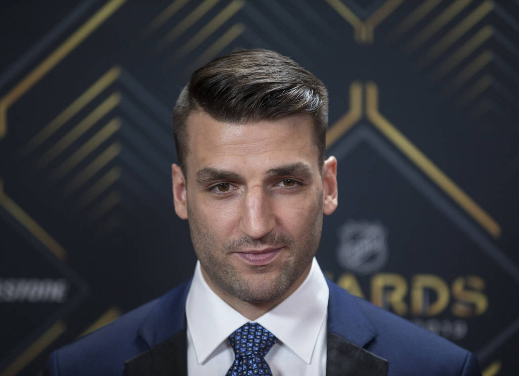Boston Bruins center Patrice Bergeron walks the red carpet before the start of the NHL Awards o ...