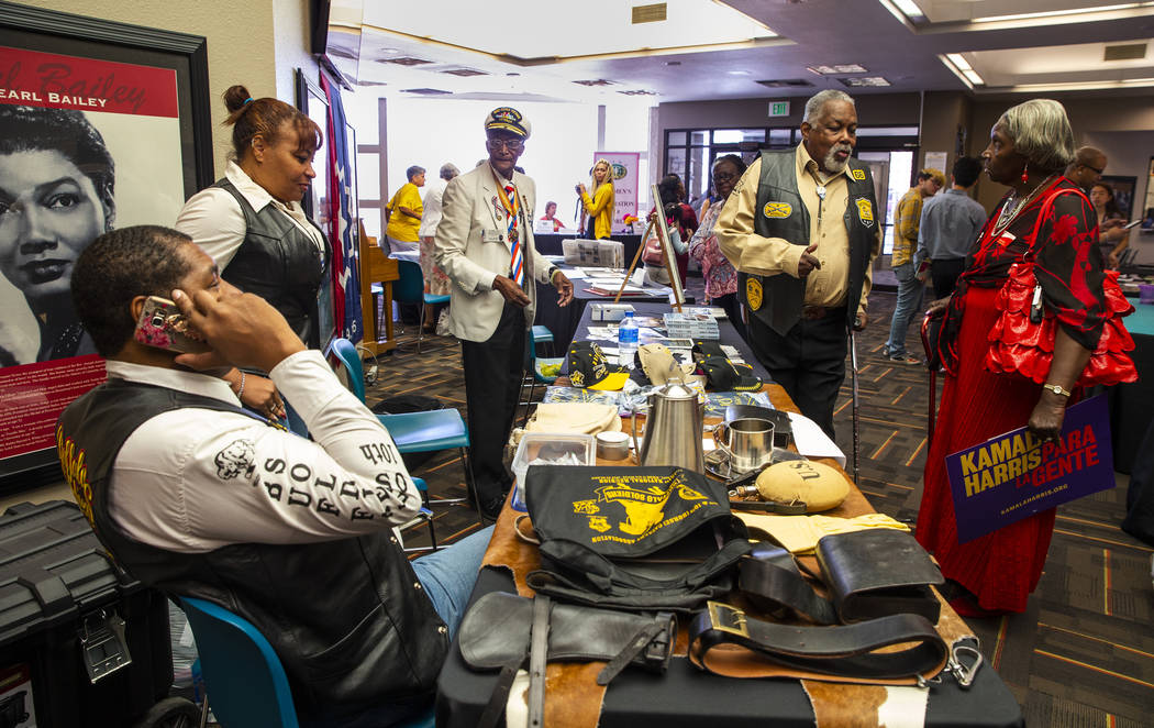The Southern Nevada chapter of the Las Vegas Buffalo Soldiers members chat with attendees durin ...