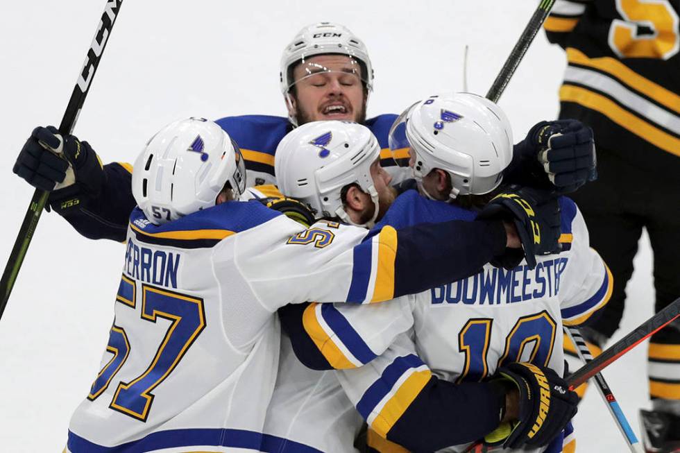 St. Louis Blues' Ryan O'Reilly, center, celebrates his goal with teammates Alex Pietrangelo, le ...