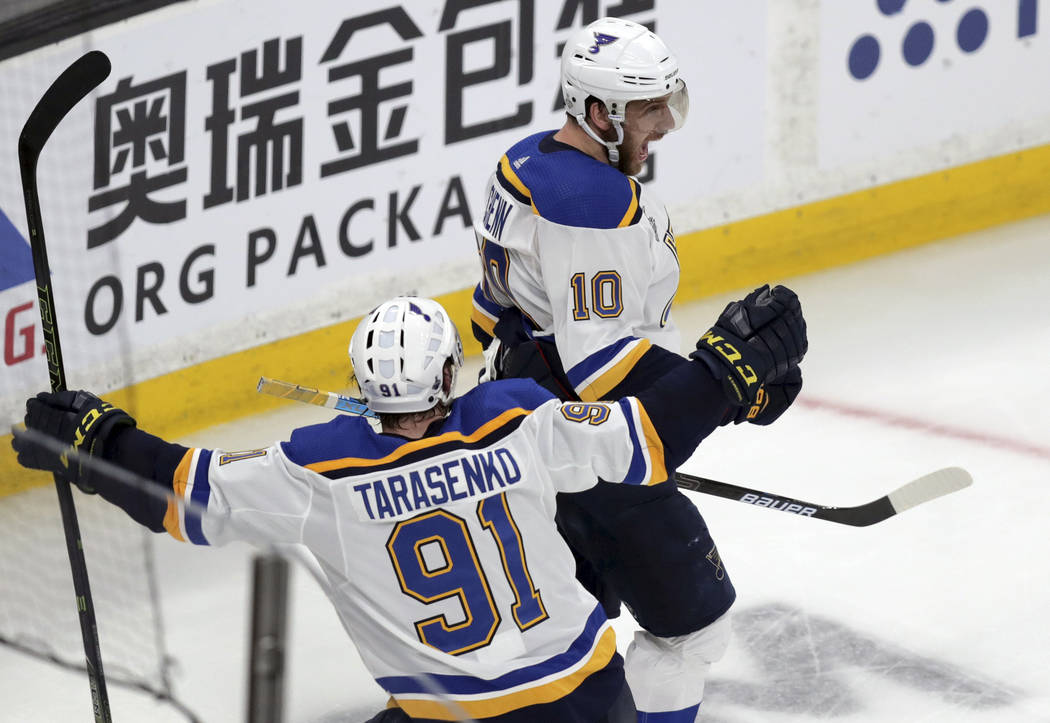 St. Louis Blues' Brayden Schenn (10) celebrates his goal against the Boston Bruins with Vladimi ...