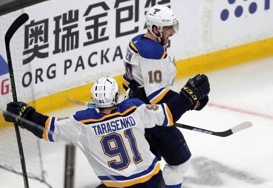 St. Louis Blues' Brayden Schenn (10) celebrates his goal against the Boston Bruins with Vladimi ...