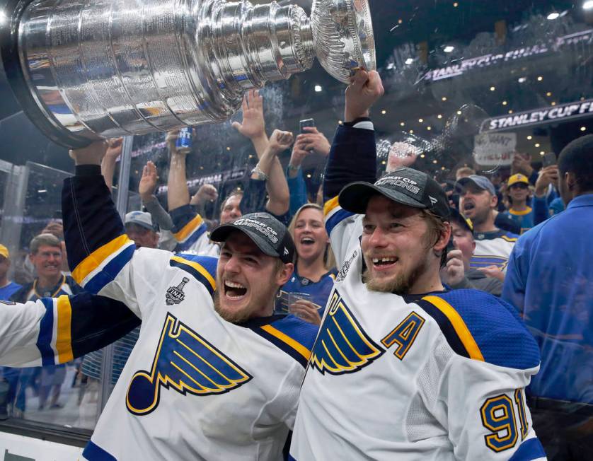 St. Louis Blues' Ivan Barbashev, left, and Vladimir Tarasenko, both of Russia, hold the Stanley ...