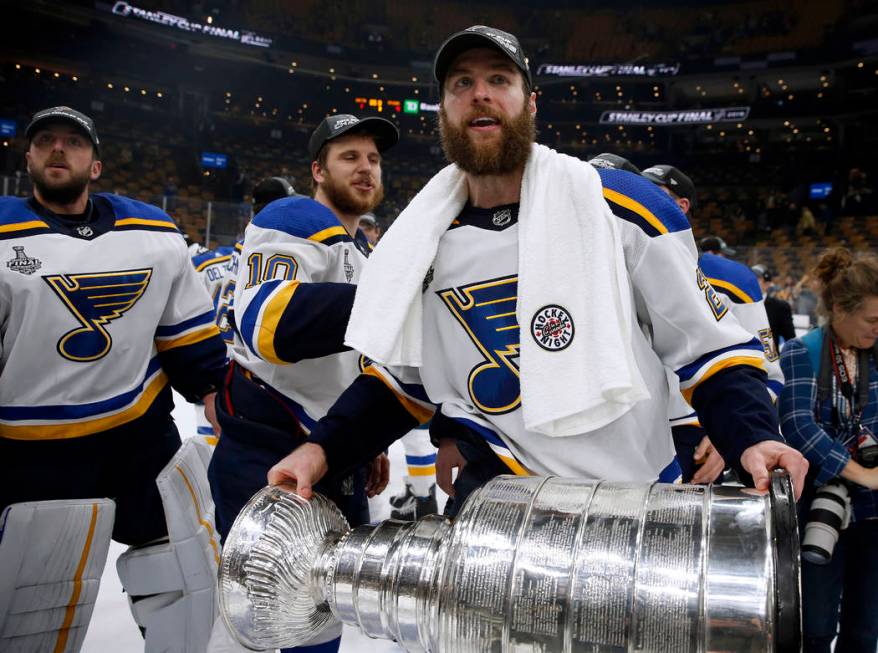 St. Louis Blues' Alex Pietrangelo carries the Stanley Cup after the Blues defeated the Boston B ...