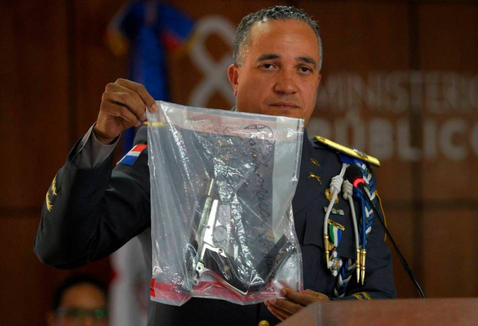 The director of the National Police, General Ney Aldrin Bautista Almonte shows the weapon that ...