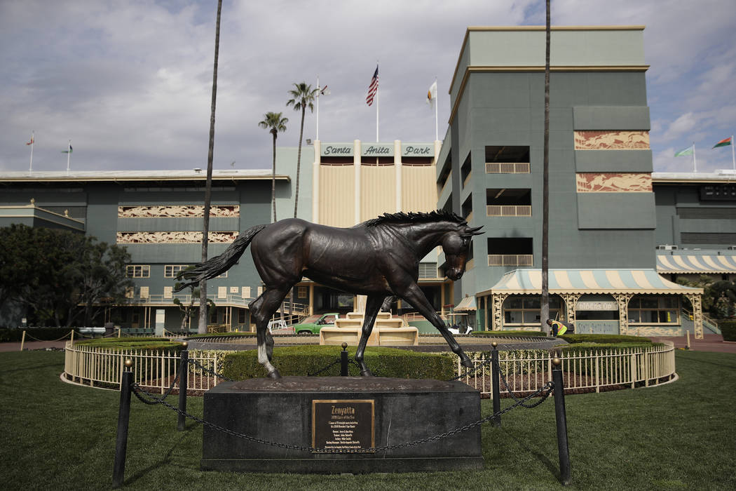 FILE - In this March 5, 2019, file photo, a statue of Zenyatta stands in the paddock gardens ar ...