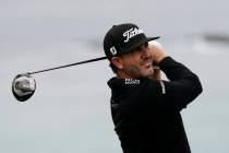 Scott Piercy watches his tee shot on the 11th hole during the first round of the U.S. Open Cham ...