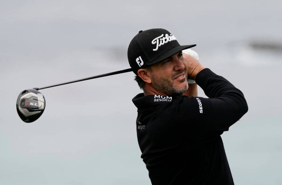 Scott Piercy watches his tee shot on the 11th hole during the first round of the U.S. Open Cham ...