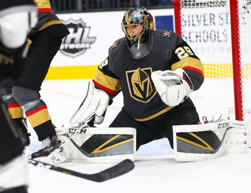 Golden Knights goaltender Marc-Andre Fleury (29) defends the net during the second period of an ...