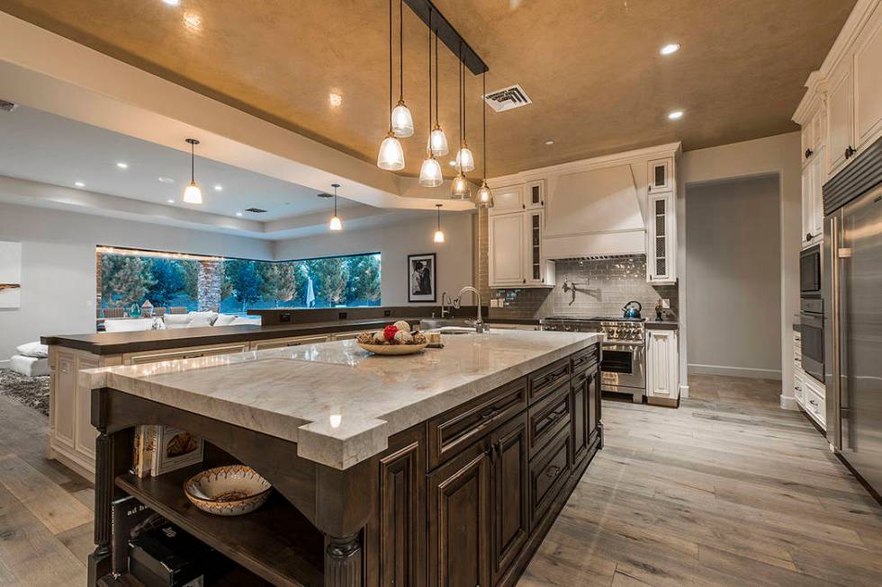The kitchen has a large center island. (Ivan Sher Group)