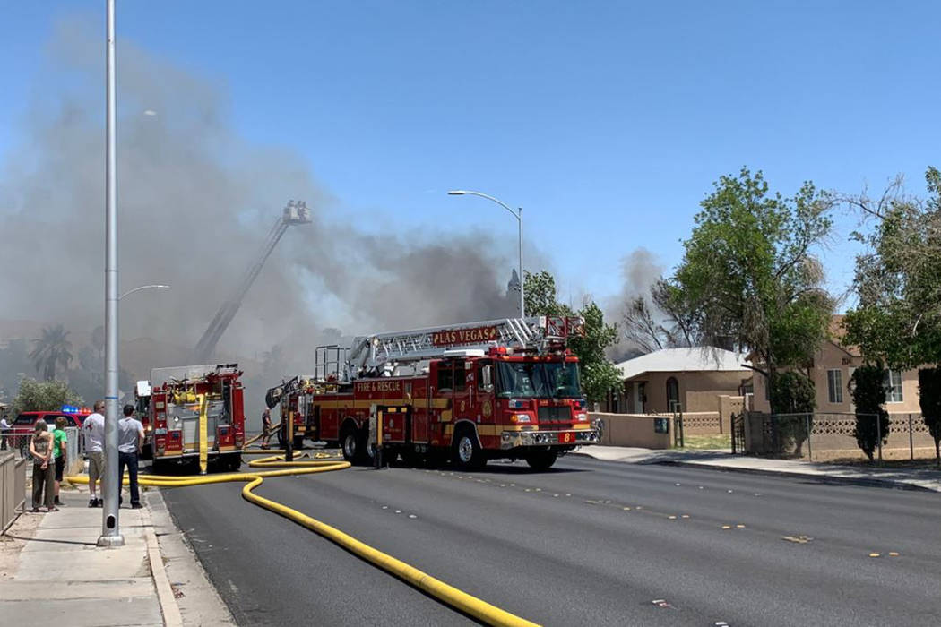 Crews respond to a house fire in the 2100 block of East Stewart Avenue in Las Vegas, Thursday, ...