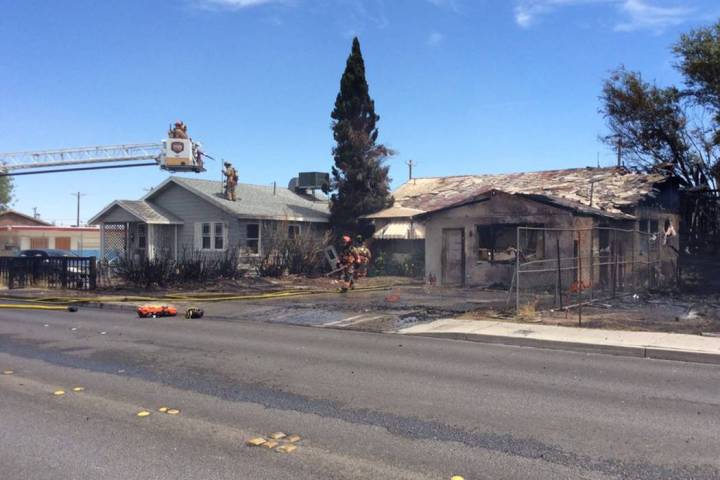 Crews respond to a house fire in the 2100 block of East Stewart Avenue in Las Vegas, Thursday, ...