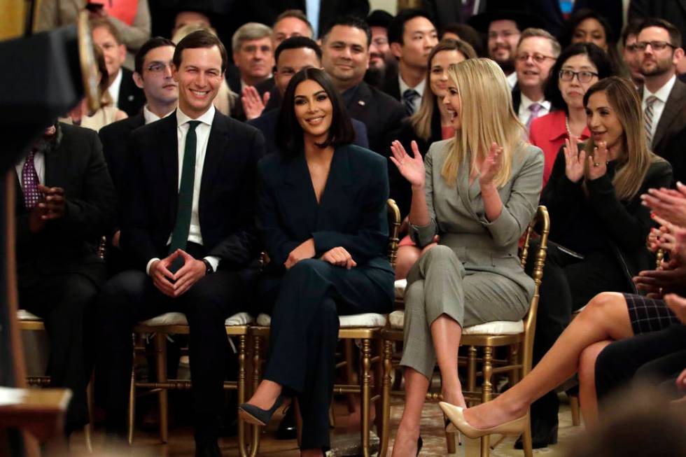 White House senior adviser Jared Kushner and Ivanka Trump, right, sit with Kim Kardashian West, ...