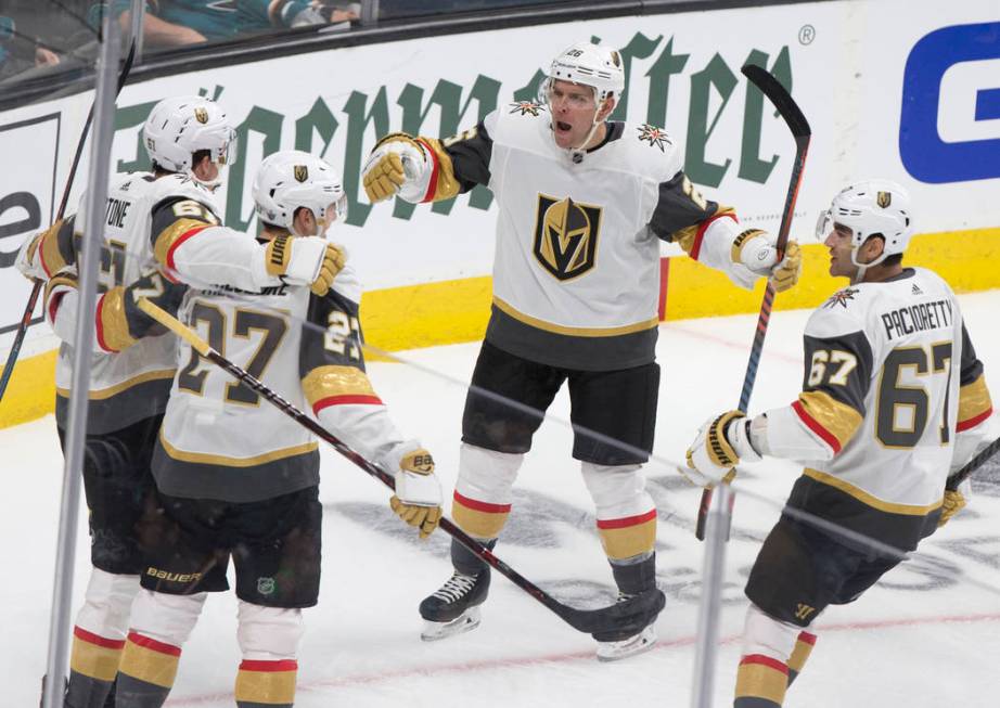 Golden Knights center Paul Stastny (26) celebrates with teammates Max Pacioretty (67) and Shea ...