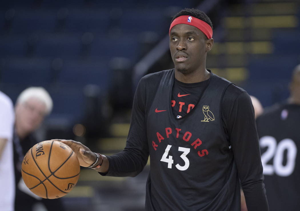 Toronto Raptors' Pascal Siakam dribbles the ball during a team practice in Oakland, Calif., Wed ...